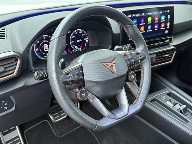 Cupra Leon 1.4 e-Hybrid VZ Business | 245 PK | SoH 86% | Adaptive Cruise Control | Achteruitrijcamera | Climate control | Dodehoek detectie | Keyless Entry | LED verlichting | Navigatiesysteem | Draadloze telefoonlader | Sfeerverlichting | Stuur- & Stoelverwarming | Parkeersensoren | Apple Carplay / Android Auto |