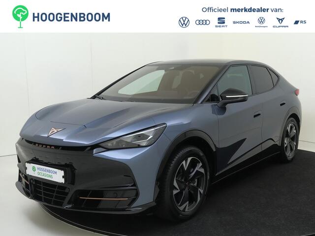 Cupra Tavascan Business 82 kWh | SoH 100% | Trekhaak | Achteruitrijcamera | 3-zone airco | Dodehoek detectie | Keyless | Adaptieve cruise control | CarPlay | Stoel- en stuurwielverwarming |