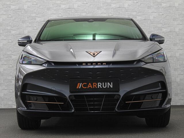 Cupra Tavascan 77 kWh | Nieuw! | Winter-Pack | Warmtepomp | Verlengde Fabrieksgarantie | 7x Op Voorraad | Adaptive Cruise Control | 3-Zone Clima | Verwarmde Voorruit | Keyless-Entry | Sfeerverlichting | Stoelverwarming | Carplay | Stuurverwarming | Getint Glas | 19 inch | Lane-Assist | Camera | Draadloos Laden |
