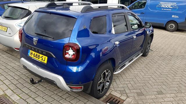 Dacia DUSTER 1.0 TCe Bi-Fuel Serie Limitee 15th Anniversary MEERDERE FOTO'S VOLGEN NOG. APPLE CARPLAY ANDROID AUTO / TREKHAAK / CLIMATE CONTROLE PARKEERSENSOREN+CAMERA / CRUISE CONTROLE.