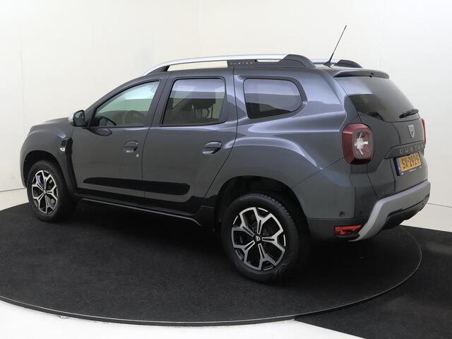 Dacia DUSTER 1.2 TCe Prestige | All-Seasonbanden | Camera | Blind Spot Warning | PDC Achter | Cruise Control & Snelheidsbegrenzer | Automatische Verlichting | 17" LMV | Privacy Glass | Apple Carplay & Android Auto
