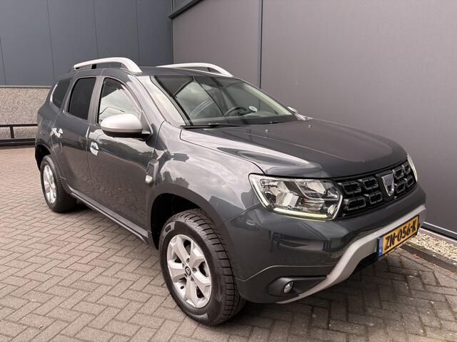 Dacia DUSTER 1.2 TCe Comfort Achteruitrijcamera - Airco - Navigatie - Trekhaak - Cruise control - Dakrails - Radio - Mistlampen voor - Start/stop systeem - Led verlichting - Elektrische ramen - Stuur multifunctioneel - Centrale vergrendeling met afstandsbediening - Bluetooth