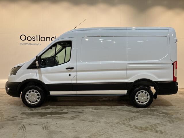 Ford E-Transit 350 L2H2 Trend 68 kWh / 100% Elektrisch !! / Airco / Cruise Control / CarPlay / Camera / Navigatie / 3-Zits / 10.400 KM !!