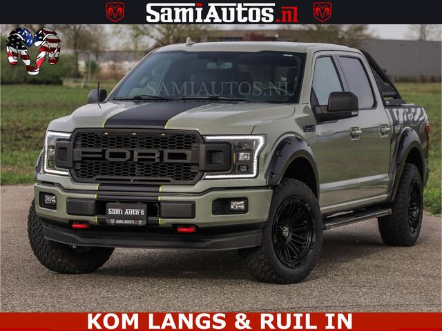 Ford F-150 5.0 V8 4X4 | MAT OLIVE GREEN | BIJTELLING VRIJ | ZEER DIK | CAMERA | 3500KG | PANORAMA | LEDER | GO RHINO ROLLBAR | CRUISE CONTROL | PRINS LPG | BAKFLIP COVER | Deze pick-up is leverbaar met zowel een groot rijbewijs (C) als een klein rijbewijs (B). Laat 