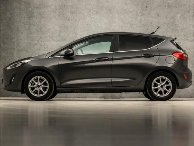 Ford FIESTA 1.0 EcoBoost Titanium (APPLE CARPLAY, GROOT NAVI, CLIMATE, GETINT GLAS, PARKEERSENSOREN, SPORTSTOELEN, CRUISE, LM VELGEN, NIEUWSTAAT)