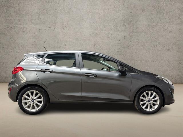 Ford FIESTA 1.0 EcoBoost Titanium (APPLE CARPLAY, GROOT NAVI, STUUR/STOELVERWARMING, BANG&OLUFSEN, CAMERA, SPORTSTOELEN, ADAPTIVE CRUISE, LM VELGEN, NIEUWSTAAT)