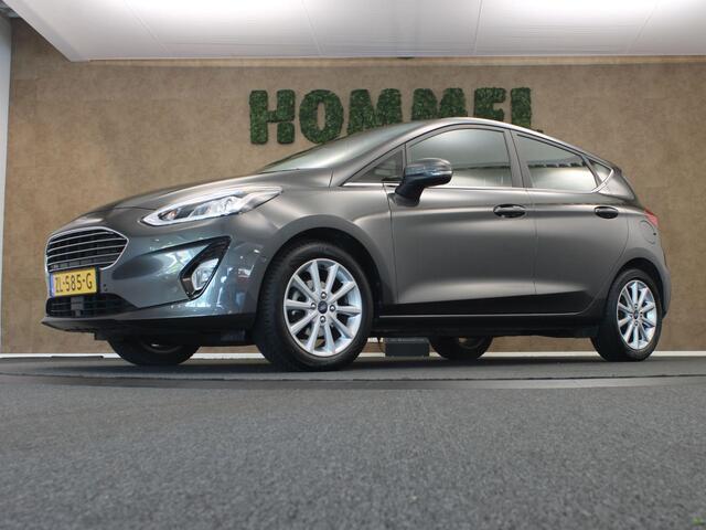 Ford FIESTA 1.0 EcoBoost Titanium - ORIGINEEL NEDERLANDSE AUTO - AFKOMSTIG VAN 1E EIGENAAR - CAMERA - PARKEERSENSOREN VOOR/ ACHTER - NAVIGATIE - CLIMATE CONTROL - 4 SEIZOENENBANDEN - DAB RADIO - PARKEERASSISTENT - VOORRUITVERWARMING - B&O AUDIOSYSTEEM - ELEKTRISCH IN