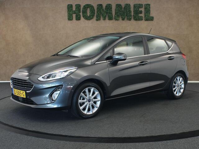 Ford FIESTA 1.0 EcoBoost Titanium - ORIGINEEL NEDERLANDSE AUTO - AFKOMSTIG VAN 1E EIGENAAR - CAMERA - PARKEERSENSOREN VOOR/ ACHTER - NAVIGATIE - CLIMATE CONTROL - 4 SEIZOENENBANDEN - DAB RADIO - PARKEERASSISTENT - VOORRUITVERWARMING - B&O AUDIOSYSTEEM - ELEKTRISCH IN