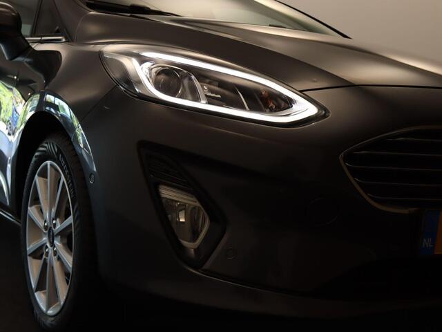 Ford FIESTA 1.0 EcoBoost Titanium - ORIGINEEL NEDERLANDSE AUTO - AFKOMSTIG VAN 1E EIGENAAR - CAMERA - PARKEERSENSOREN VOOR/ ACHTER - NAVIGATIE - CLIMATE CONTROL - 4 SEIZOENENBANDEN - DAB RADIO - PARKEERASSISTENT - VOORRUITVERWARMING - B&O AUDIOSYSTEEM - ELEKTRISCH IN