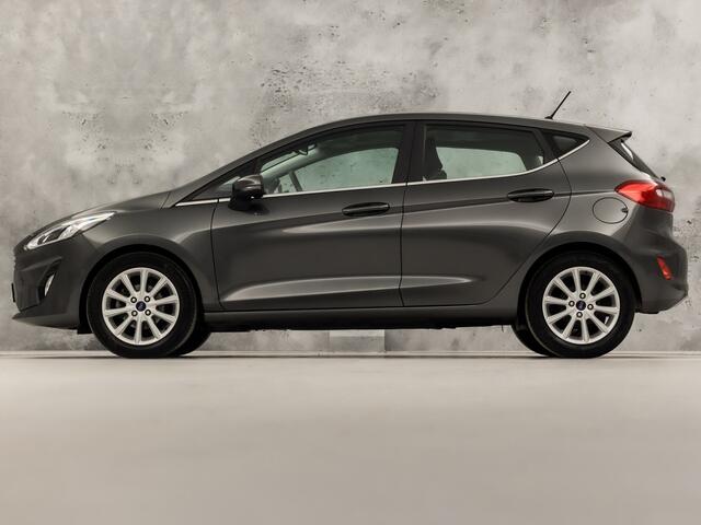 Ford FIESTA 1.0 EcoBoost Titanium (APPLE CARPLAY, GROOT NAVI, BANG&OLUFSEN, STUUR/STOELVERWARMING, CAMERA, SPORTSTOELEN, ADAPTIVE CRUISE, LM VELGEN, NIEUWSTAAT)