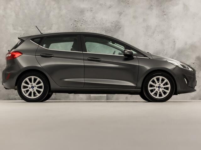Ford FIESTA 1.0 EcoBoost Titanium (APPLE CARPLAY, GROOT NAVI, BANG&OLUFSEN, STUUR/STOELVERWARMING, CAMERA, SPORTSTOELEN, ADAPTIVE CRUISE, LM VELGEN, NIEUWSTAAT)