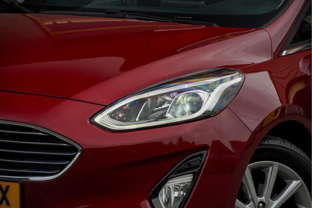 Ford FIESTA 1.0 EcoBoost 5drs Titanium BJ2020 Lmv 16" | Led V+A | Pdc | Verwarmde voorruit | Navi | Cruise control | Climate control | Sportstoelen | Verwarmd stuur | Verwarmde voorstoelen | Getint glas