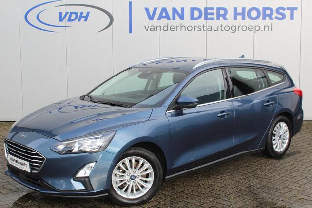 Ford FOCUS Wagon 1.0-125pk EcoBoost Mild-hybrid Titanium. Mooie, ruime, luxe en comfortabele Ford Focus wagon. Volautm. airco dual, camera, stoel-, stuur- en voorraamverw., easy entry/easy go, cruise control, Isofix, side- en lane assist, parkeersensoren v+a, LM wie