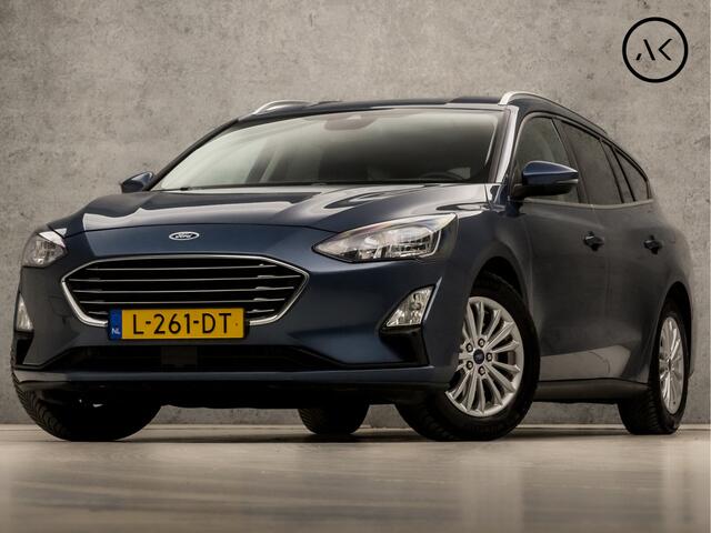 Ford FOCUS Wagon 1.0 EcoBoost Titanium X Automaat (VIRTUAL COCKPIT, APPLE CARPLAY, GROOT NAVI, STUUR/STOELVERWARMING, BANG&OLUFSEN, CAMERA, TREKHAAK, SPORTSTOELEN, ELEK ACHTERKLEP, KEYLESS, GETINT GLAS, NIEUWSTAAT)
