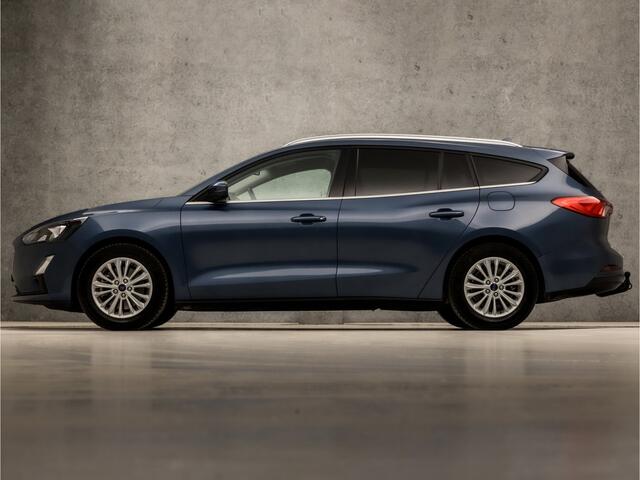 Ford FOCUS Wagon 1.0 EcoBoost Titanium X Automaat (VIRTUAL COCKPIT, APPLE CARPLAY, GROOT NAVI, STUUR/STOELVERWARMING, BANG&OLUFSEN, CAMERA, TREKHAAK, SPORTSTOELEN, ELEK ACHTERKLEP, KEYLESS, GETINT GLAS, NIEUWSTAAT)