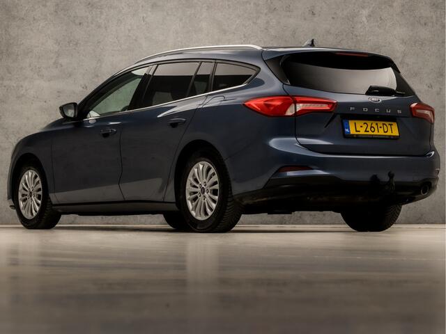Ford FOCUS Wagon 1.0 EcoBoost Titanium X Automaat (VIRTUAL COCKPIT, APPLE CARPLAY, GROOT NAVI, STUUR/STOELVERWARMING, BANG&OLUFSEN, CAMERA, TREKHAAK, SPORTSTOELEN, ELEK ACHTERKLEP, KEYLESS, GETINT GLAS, NIEUWSTAAT)