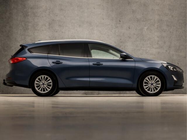 Ford FOCUS Wagon 1.0 EcoBoost Titanium X Automaat (VIRTUAL COCKPIT, APPLE CARPLAY, GROOT NAVI, STUUR/STOELVERWARMING, BANG&OLUFSEN, CAMERA, TREKHAAK, SPORTSTOELEN, ELEK ACHTERKLEP, KEYLESS, GETINT GLAS, NIEUWSTAAT)
