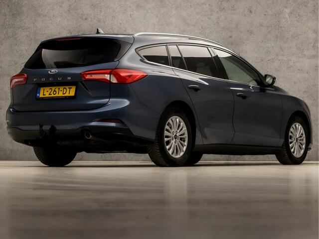 Ford FOCUS Wagon 1.0 EcoBoost Titanium X Automaat (VIRTUAL COCKPIT, APPLE CARPLAY, GROOT NAVI, STUUR/STOELVERWARMING, BANG&OLUFSEN, CAMERA, TREKHAAK, SPORTSTOELEN, ELEK ACHTERKLEP, KEYLESS, GETINT GLAS, NIEUWSTAAT)