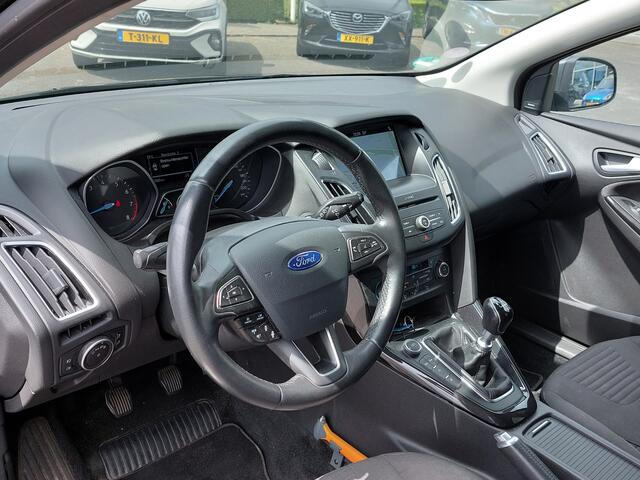 Ford FOCUS Wagon 1.0 EcoBoost 125pk Titanium | Origineel NL | Navi | Apple Carplay+Android Auto | Bi-Xenon | SONY Sound | Clima | Cruise | Keyless Entry | Pdc V+A+Assist+Camera | Privacy Glass | 17''lm