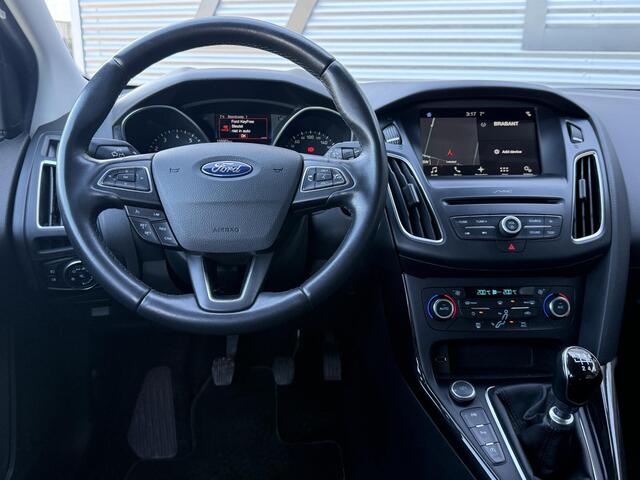 Ford FOCUS Wagon 1.0 Titanium 1e Eigenaar,Navi,Clima,Cruise,PDC V+A,Dealer Onderhouden,6-Bak,N.A.P,APK tot 04-2026