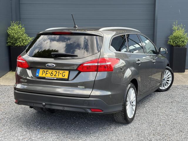 Ford FOCUS Wagon 1.0 Titanium 2e Eigenaar,Navi,Trekhaak,125pk,Clima,Cruise,Pdc V+A,6 Bak,Lm velgen,N.A.P,Apk tot 07-2027