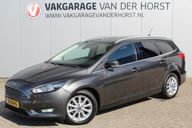 Ford FOCUS Wagon 1.0-125pk Titanium. Zeer nette, praktische en goed onderhouden wagen, afkomstig van de 1e eig. ! Autm. airco dual, cruise control, trekhaak, verwarmd voorraam, navigatie, telefoonvoorb., metallic lak, pdc v~a, LM wielen, All Season banden etc.