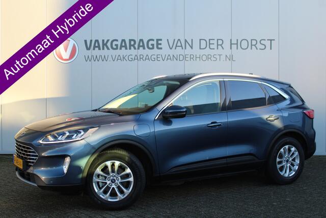 Ford KUGA 2.5-225pk PHEV Titanium X. Luxe hybride rijden voor een reëel bedrag ! Autm. airco, stoel-, stuur- en voorraamverw., elektr. panoramadak, navigatie, telefoonvoorb., camera v+a, elektr. trekhaak, elektr. achterklep, adaptieve cruise cntrl etc.