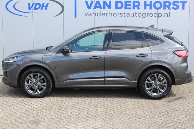 Ford KUGA 2.5-225pk Plug-in Hybrid ST-Line X. Hybride rijden voor een reële prijs ! Autm. airco dual, side- en lane assist, adaptieve cruise cntrl, camera v+a, stoel- en voorraamverw., elektr. achterklep, metallic lak, navigatie, telefoonvoorb.