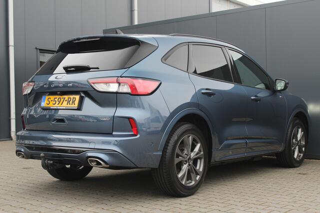 Ford KUGA 2.5 PHEV ST-Line X | Incl. 12 maanden garantie | Trekhaak | B&O audio | Achteruitrijcamera | Camera voor | Parkeersensoren | Cruise control | DAB | Elektrische kofferklep | Lichtmetalen velgen | Climate control | Bluetooth | Airco
