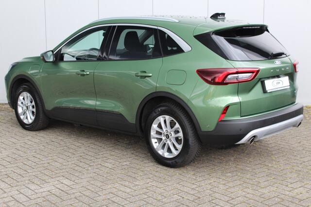 Ford KUGA 2.5-243pk PHEV Titanium. Hybride rijden voor een reëel bedrag. Slechts 11.500km ! Autm. airco dual, camera v+a, metallic lak, all season banden rondom, lane- en sideassist, adaptieve cruise control, winterpakket, navigatie, telefoonvoorb. etc