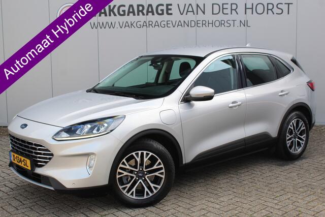 Ford KUGA 2.5-225pk PHEV Titanium. Hybride rijden voor een reëel bedrag ! Autm. airco dual, stoel-, stuur-, achterbank- en voorraamverw., navigatie, telefoonvoorb., trekhaak, metallic lak, LM wielen+ AllSeason banden etc.