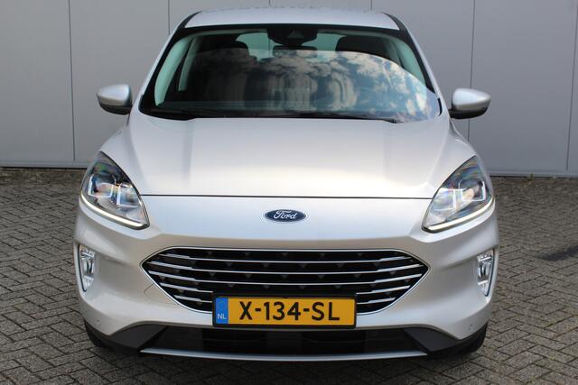 Ford KUGA 2.5-225pk PHEV Titanium. Hybride rijden voor een reëel bedrag ! Autm. airco dual, stoel-, stuur-, achterbank- en voorraamverw., navigatie, telefoonvoorb., trekhaak, metallic lak, LM wielen+ AllSeason banden etc.