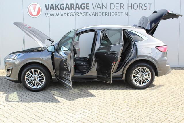 Ford KUGA 2.5-225pk PHEV Vignale. In uiterst nette staat verkerende Ford Kuga in de zeer chique Vignale uitvoering met slechts 23.000km ! Adapt. cruise cntrl, side- en lane assist, trekhaak, head-up display, B&O soundsyst., lederen int., stuur-, stoel-, achterbank- en voorraamverw. etc.