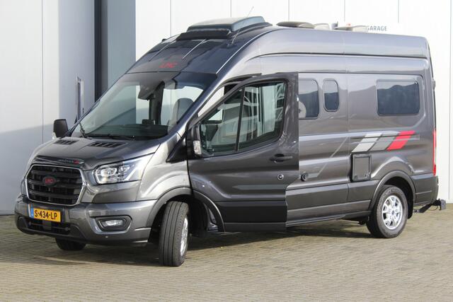 Ford LMC C590 'Innovan' Buscamper. Geniet van de vrijheid ! Geweldig mooie LMC buscamper ! V.v. de krachtige 170pk Ford dieselmotor. Airco, voorraamverw., Xenon verlichting, trekhaak, luifel, metallic lak, LM wielen, garage, camera, adapt. cruise cntrl, lane assist, koel-, vriesvak, toilet