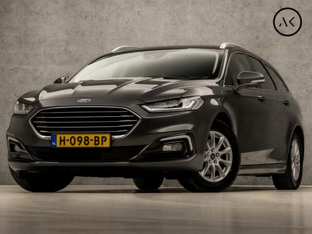 Ford MONDEO Wagon 2.0 IVCT HEV Titanium 191Pk Automaat (APPLE CARPLAY, GROOT NAVI, CAMERA, STOELVERWARMING, ELEK SPORTSTOELEN, TREKHAAK, GETINT GLAS, ADAPTIVE CRUISE, NIEUWE APK, NIEUWSTAAT)