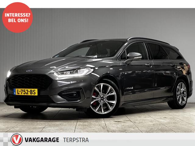 Ford MONDEO Wagon 2.0 IVCT HEV ST-Line/ Dealer Onderhouden!/ Automaat/ Zwarte Hemel/ Camera/ Elek.Klep/ Stoel+Voorruitverw./ Elek.Stoel+Memory/ 18''LMV/ LED Koplampen/ Keyless/ Dodehoekdet./ Apple+Android/ Clima/ Navi/ Cruise/ PDC.
