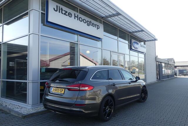 Ford MONDEO Wagon 2.0 IVCT HEV Titanium 18 INCH, ELEKT. TREKHAAK (750KG), WINTER PACK, MEMORY, CRUISE, CLIMA, NAVI, CAMERA, PDC V&A, APPLE CARPLAY/ANDROID AUTO, BLIS, KEYLESS, ELEKT. PASSAGIERSSTOEL, ELEKT. ACHTERKLEP, ADAPTIEVE KOPLAMPEN, LANE ASSIST, 57.812KM