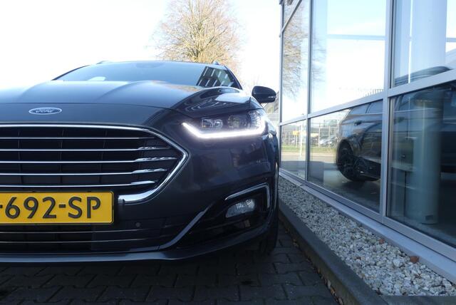 Ford MONDEO Wagon 2.0 IVCT HEV Titanium 18 INCH, ELEKT. TREKHAAK (750KG), WINTER PACK, MEMORY, CRUISE, CLIMA, NAVI, CAMERA, PDC V&A, APPLE CARPLAY/ANDROID AUTO, BLIS, KEYLESS, ELEKT. PASSAGIERSSTOEL, ELEKT. ACHTERKLEP, ADAPTIEVE KOPLAMPEN, LANE ASSIST, 57.812KM