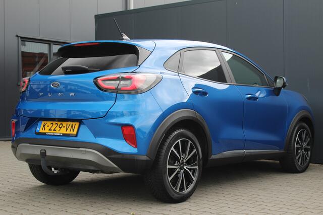 Ford PUMA 1.0 EcoBoost Titanium | Incl. 12 maanden garantie | Trekhaak | Dodehoek detectie | Cruise control | Apple Carplay/Android auto | Lichtmetalen velgen | Elektrische kofferklep | DAB | Airco | Climate control | Navigatie