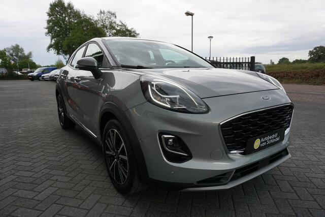Ford PUMA 1.0 EcoBoost Hybrid Titanium AUTOMAAT LUXE! DEC. 2021 APPLE CARPLAY - ANDROID - CAMERA - PDC V+A - LED - STOELVERWARMING - STUURVERWARMING - VOORRUITVERWARMING - PARKEERHULP - DAB+ - 17 INCH LMV - NAVI - RIJSTROOKSENSOR