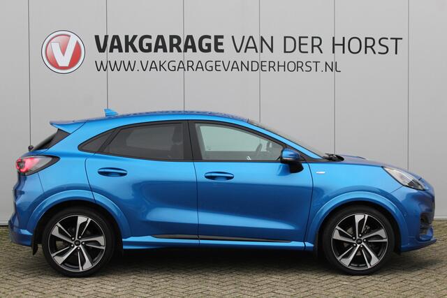 Ford PUMA 1.0-155pk EcoBoost Hybrid ST-Line X. Erg mooi, nette, luxe en sportieve Ford Puma ! Autm. airco, stoel-, stuur- en voorraamverw., camera, elektr. achterkl., trekhaak+afneemb. kogel, B&O soundsyst., lane- en side assist, adapt. cruise cntrl, LED verl. etc.
