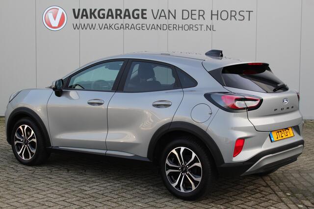 Ford PUMA 1.0-125pk EcoBoost Mild-Hybrid Titanium. Fabrieksgarantie t/m 23-03-2029 ! Werkelijk in nieuwstaat maar wel ruim ¤. 6.000,- beneden de nieuwprijs ! Autm. airco, stoel-, stuur- en voorraamverw., adapt. cruise cntrl, side- en lane assist, navigatie, telefoo