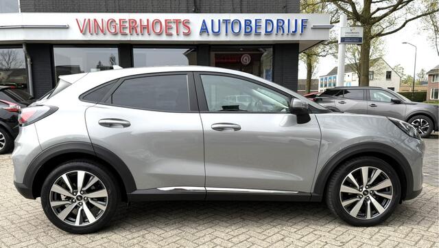 Ford PUMA 125 Pk Titanium X Benzine * Navigatie * Adaptive Cruise Control * Achteruitrij Camera * 18" L.M. Velgen * Vingerhoets; Vierde Generatie Eersteklas Service. Al meer dan 100 jaar een begrip in de Brabantse Kempen.