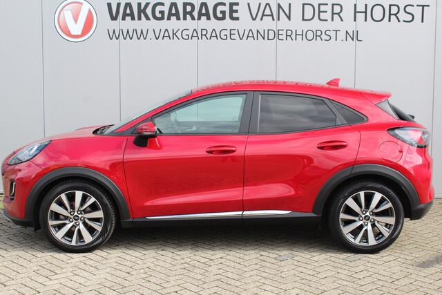 Ford PUMA 1.0-125pk EcoBoost Mild-Hybrid Titanium X. Mooie, chique en luxe Ford Puma, hoge in- en uitstap ! Autm. airco, adapt. cruise cntrl, side- en lane assist, stoel-, stuur- en voorraamverw., navigatie, telefoonvoorb., all season banden, LED verl., B&O soundsyst. etc.