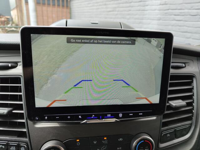 Ford TRANSIT 2.0TDCI 130pk 350 L4H3 Navi Camera Pdc Apple Carplay Android WiFi Airco Cruise Control Voorruit-Verwarmd Regensensor DAB Schuifdeur Betonplex Vloer Wandbetimmering Roll Stability Control Led Spoorwisselassist Euro 6 Zeer Compleet!