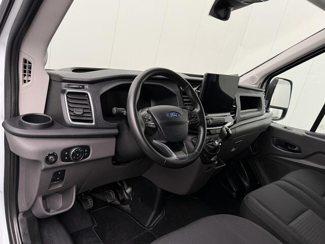Ford TRANSIT 130PK L3H2 | Navigatie | Camera | Airco | Cruise | Trekhaak | Betimmering | 3-Zits