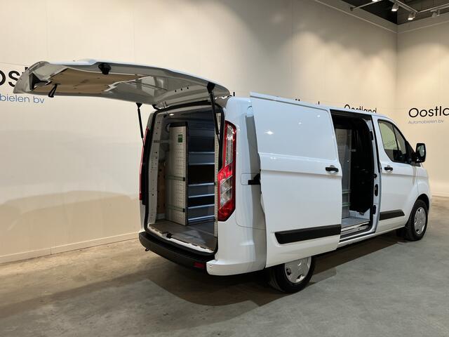 Ford TRANSIT CUSTOM 300 2.0 TDCI L1H1 Trend 130 PK / Servicebus / Bott Inrichting / Euro 6 / Schuifdeur L + R / Airco / CarPlay / Klep / PDC / Navigatie / 3-Zits