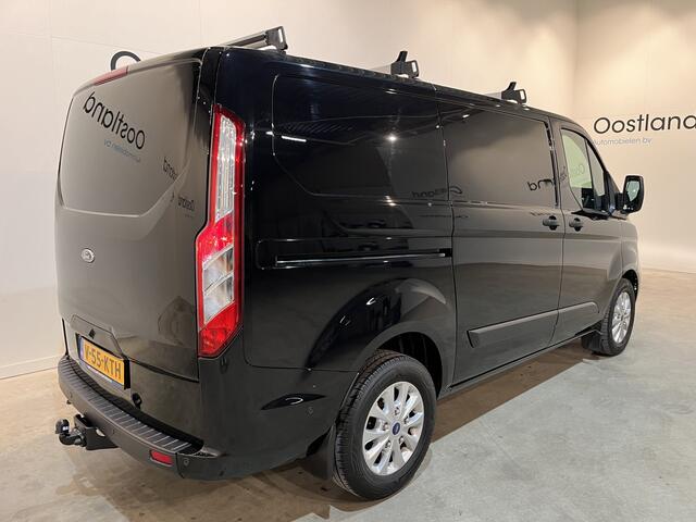 Ford TRANSIT CUSTOM 2.0 TDCI L1H1 Trend 130 PK Automaat / CarPlay / Camera / Airco / Cruise Control / Trekhaak / LMV / Navigatie / Klep / 3-Zits / 80.350 KM !! / BPM VRIJ !!