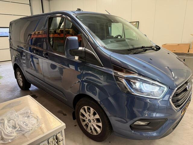 Ford TRANSIT CUSTOM 280 2.0 TDCI 130 PK AUTOMAAT L1H1 Limited | Camera | Adaptieve Cruise Control | BLIS | Lederen bekleding | Trekhaak | Winterpakket | Zijschuifdeur L+R
