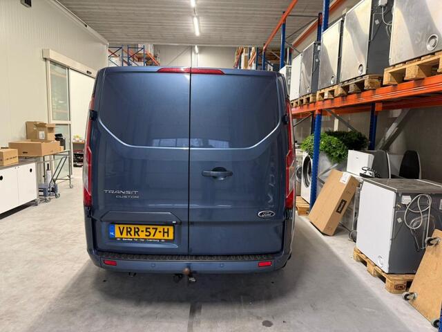 Ford TRANSIT CUSTOM 280 2.0 TDCI 130 PK AUTOMAAT L1H1 Limited | Camera | Adaptieve Cruise Control | BLIS | Lederen bekleding | Trekhaak | Winterpakket | Zijschuifdeur L+R